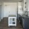 a kitchen with white cabinets
