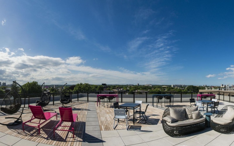 a patio with chairs and table